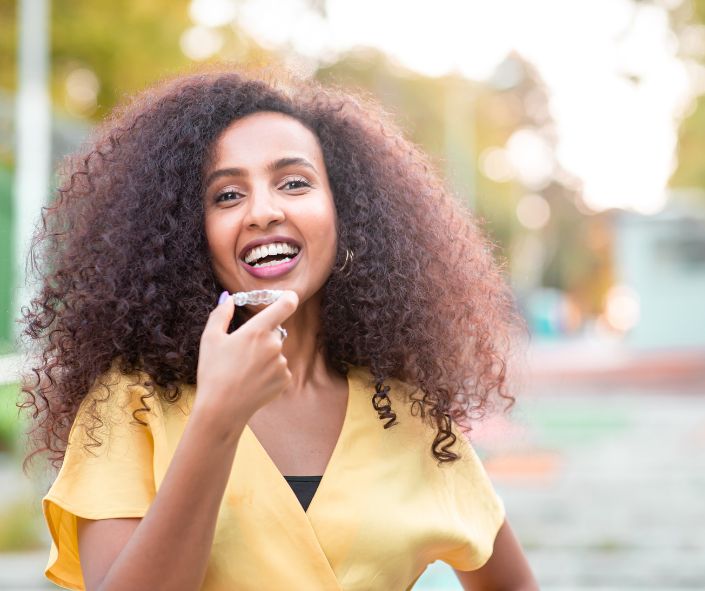 woman with invisalign